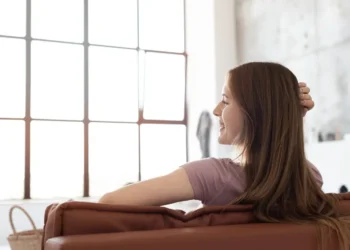 “Overwhelmed woman pausing to breathe as she begins practicing Small Emotional Habits for emotional clarity and better productivity.